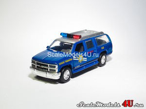 Scale model of Chevrolet Suburban Nevada Highway Patrol K-9 (1995) produced by Road Champs.